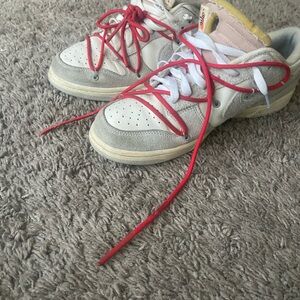 Off-White Sneakers with Red and White Accents